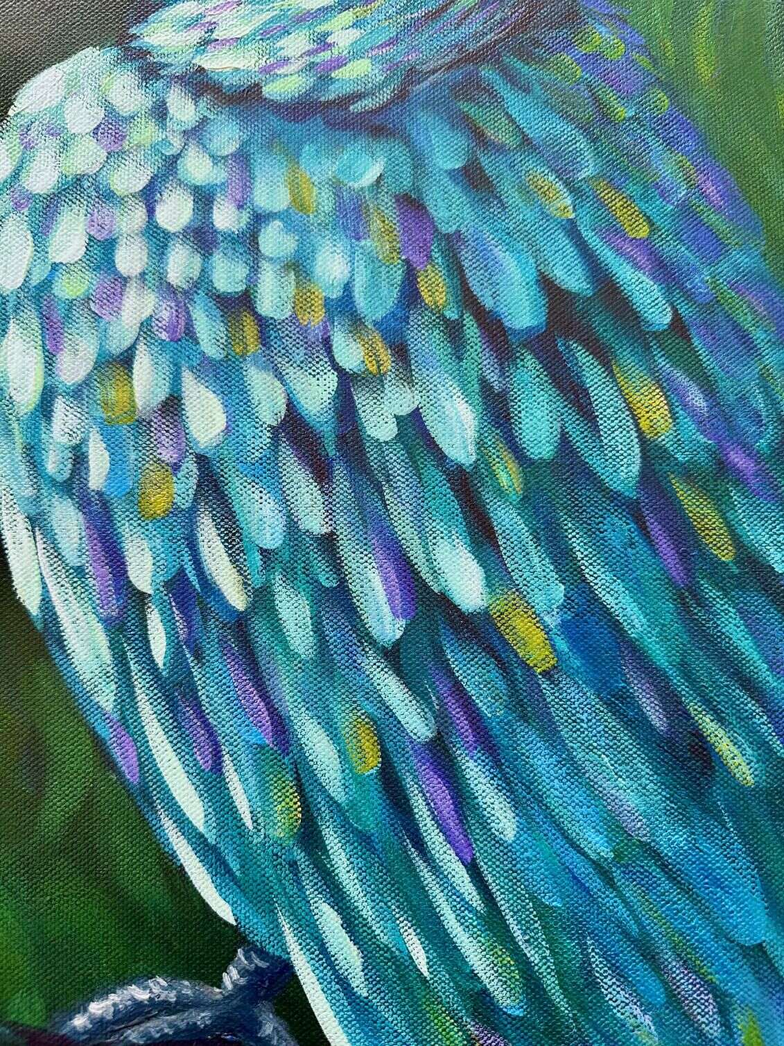 Vibrant parrot painting titled Jewelled Feathers by Australian artist Cassie Holmes, featuring blue, green, and lilac feathers painted in acrylic and oil.
